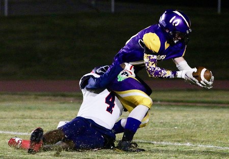 Lemoore's Lucas Jensen reaches out to get the ball over the goal line for the game's first touchdown. 